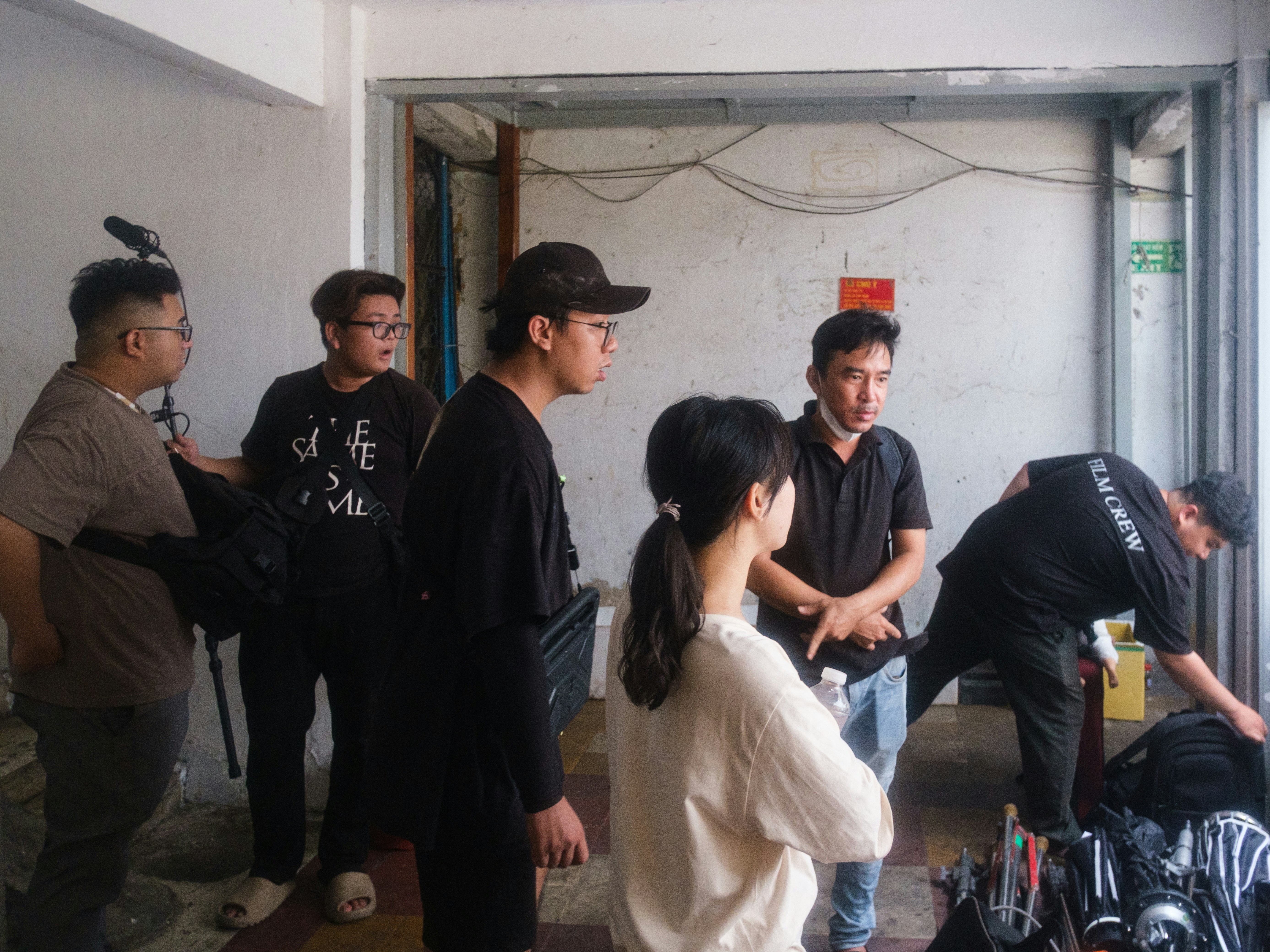 A group of young adults gathered indoors